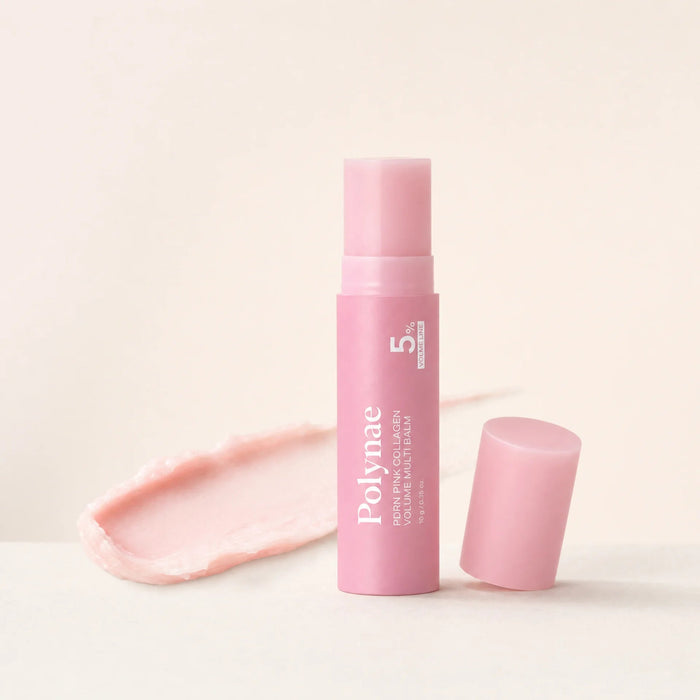 CureRox PDRN Collagen Volume Multi Balm stick, upright with cap removed beside a balm swatch